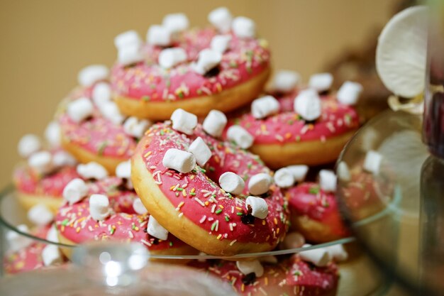 Closeup of pink donuts in a bowl