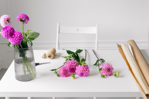 Premium Photo  Closeup of pink young dahlias lying on a white