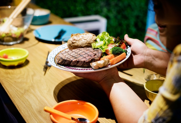 Closeup of a plate of steak with vegetables