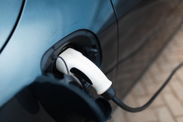 Closeup of plug for electric car on charging station