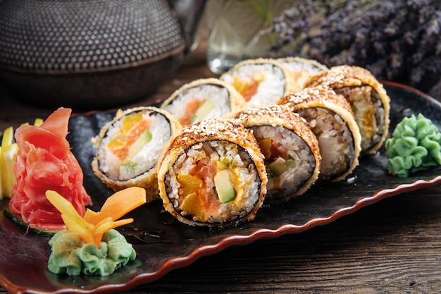 Photo closeup on portion of deep fried sushi rolls