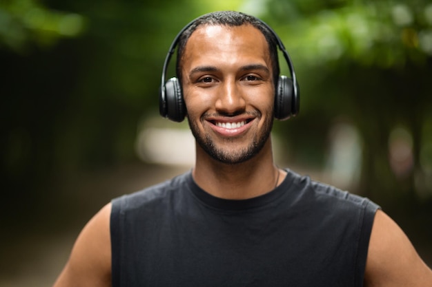 Closeup portrait of african american young athlete training in park