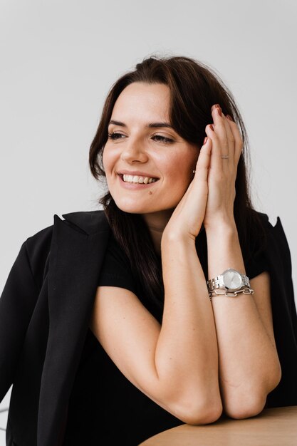 Closeup portrait of attractive smiling girl on white background Young woman enjoying lifestyle and dreaming about something