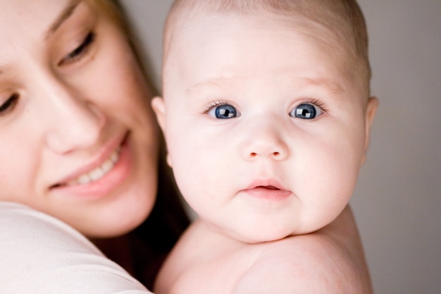 Closeup portrait of  baby and mother