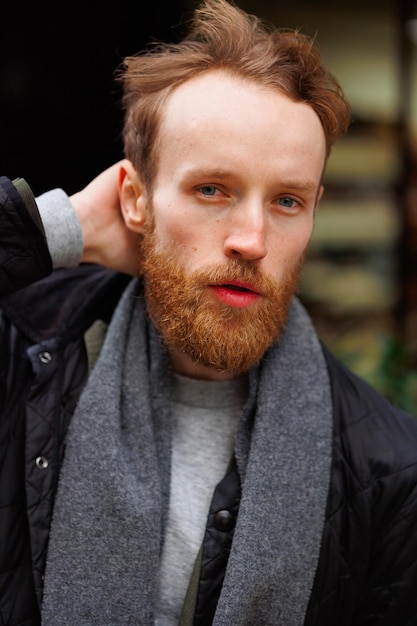 Closeup portrait of a bearded man outdoors