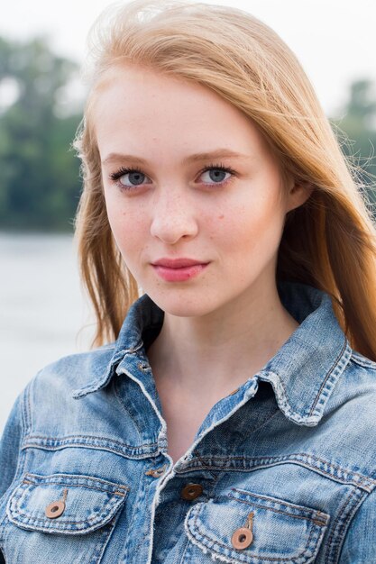 Closeup portrait of a beautiful blonde woman in nature