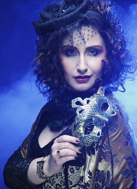 Closeup portrait of a beautiful woman with carnival mask