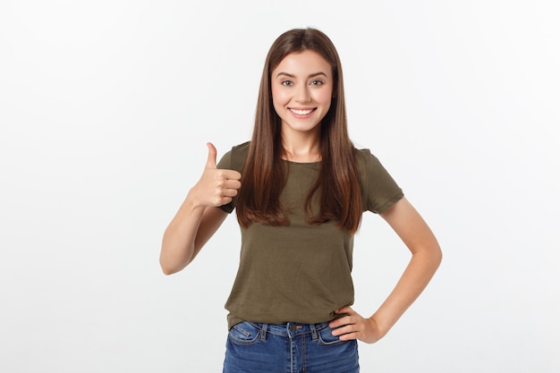 Closeup portrait of a beautiful young woman showing thumbs up sign