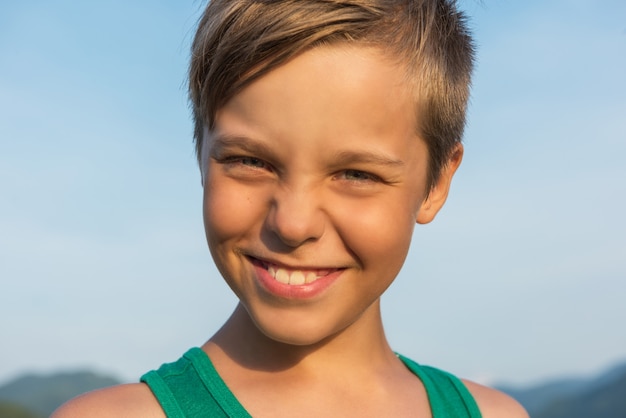 Closeup portrait of a boy in summer day.