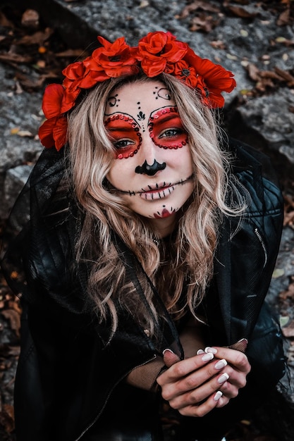 Closeup portrait of Calavera Catrina. Young woman with sugar skull makeup. Dia de los muertos. Day of The Dead. Halloween. Santa Muerte makeup woman on Halloween eve