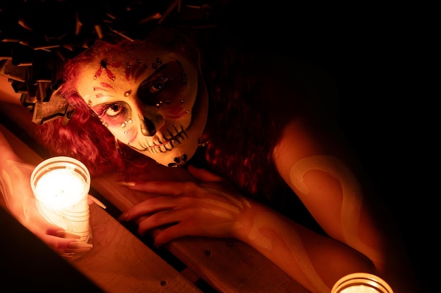 Closeup portrait of calavera catrina young woman with sugar skull makeup dia de los muertos day o