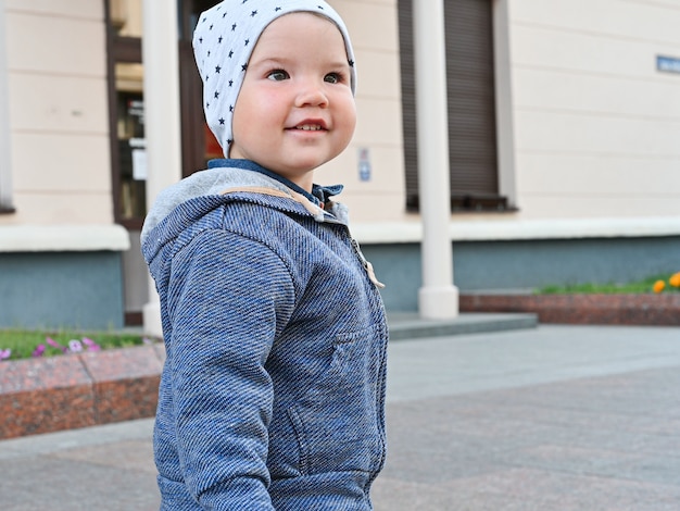 Closeup portrait of a child walking in the city