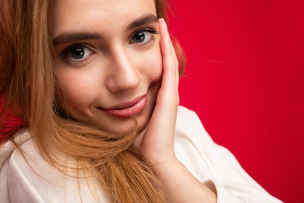 Closeup portrait of cute young beautiful dark blonde woman with sincere emotions