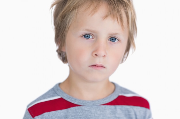 Photo closeup portrait of cute young boy with blue eyes