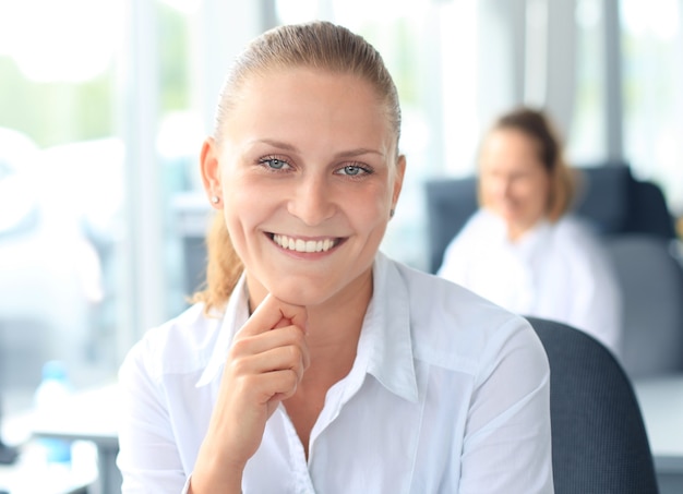 Closeup portrait of cute young business woman smiling