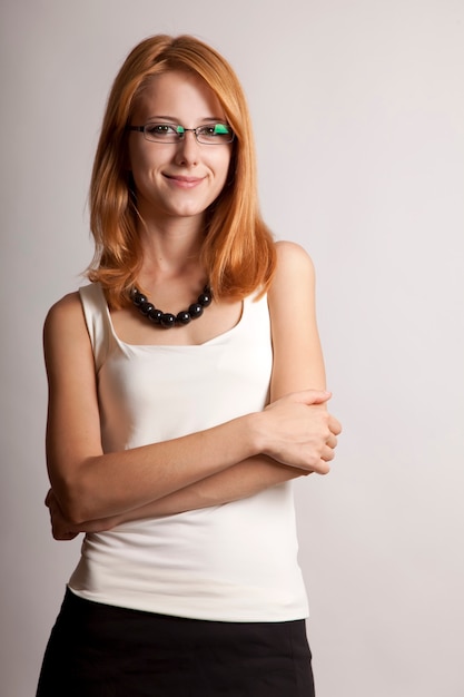 Closeup portrait of cute young redhead business woman