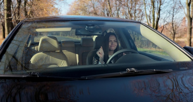 Closeup portrait displeased angry pissed off aggressive woman driving car. Negative human emotions face expression.