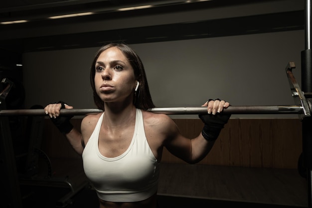 Closeup portrait of empowered female weightlifter