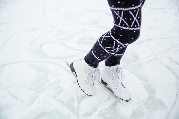 Closeup portrait of a female legs in ice skates