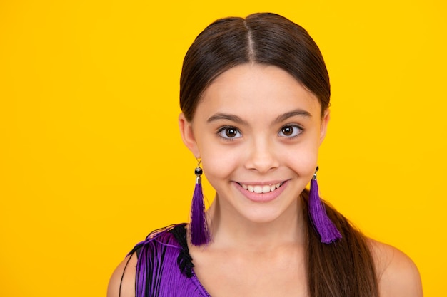 Closeup portrait of girl teen smile happiness face Portrait of a cute teen child Studio shot isolated background