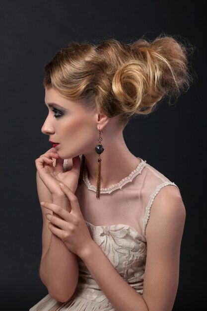 Closeup portrait girl in vintage shabby chic retro style and white dresses on a black background