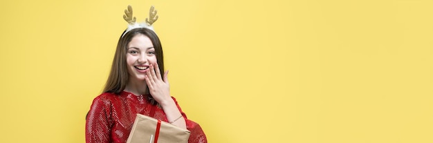 Closeup portrait of a girl with gifts in her hands