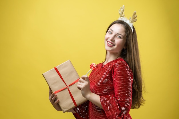 Closeup portrait of a girl with gifts in her hands