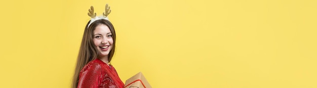 Closeup portrait of a girl with gifts in her hands