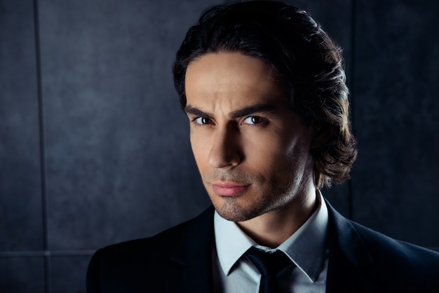 Closeup portrait of handsome  young man in formalwear with stubble