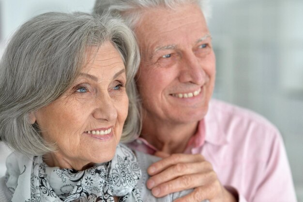 Closeup portrait of a happy senior couple at home