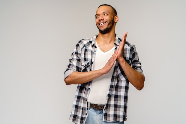 Closeup portrait of happy young handsome man rubbing hands together in anticipation