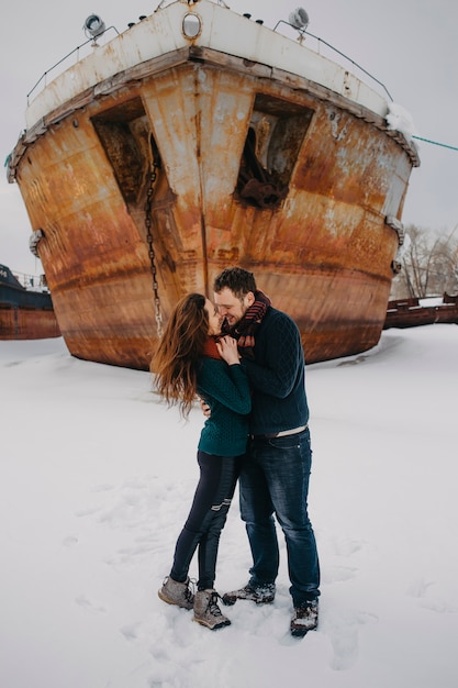 Closeup portrait of lovers man and woman in winter at the seaport