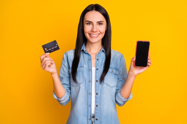 Closeup portrait of nice lovely pretty confident girl holding phone credit card