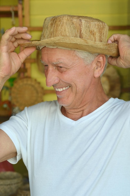 Closeup portrait of nice mature man in hat