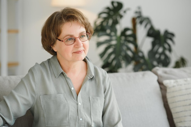 Closeup portrait of older woman wearing glasses