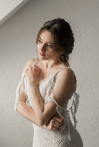 Closeup portrait of pretty bride in luxury wedding dress