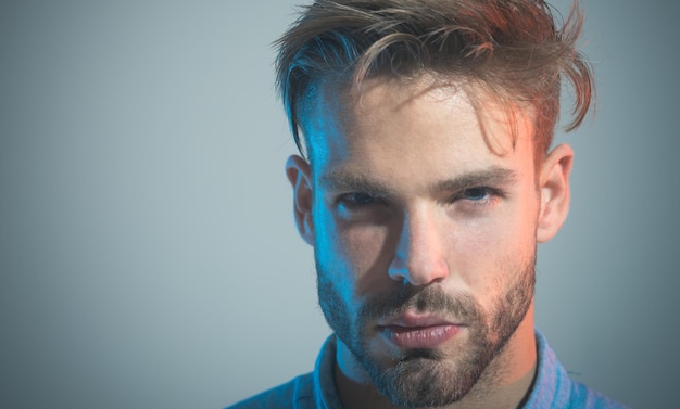 Closeup portrait serious pensive elegant unshaven man with stylish hairdo hairstyl trendy stylish