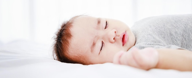 Closeup portrait of a sleeping newborn baby banner size