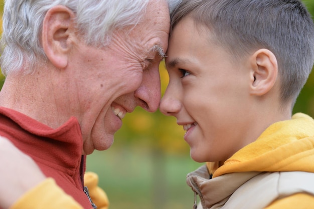 Closeup portrait of smiling grandfather and grandson