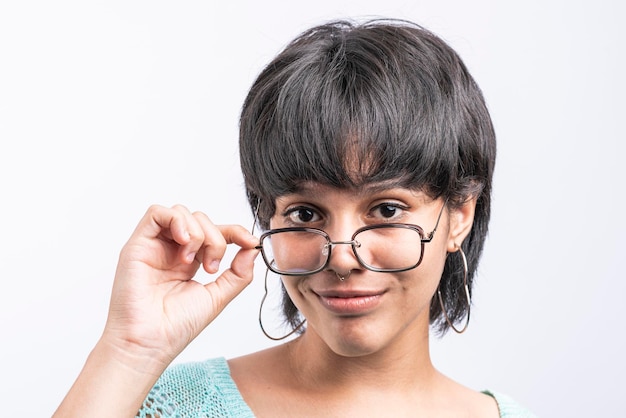 Closeup portrait of a smiling latina woman with glasses on white background