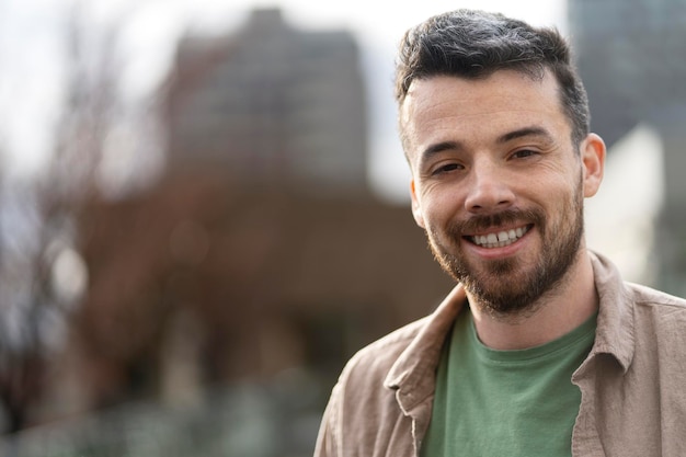 Closeup portrait of a smiling middle aged Latin man looking at the camera copy space