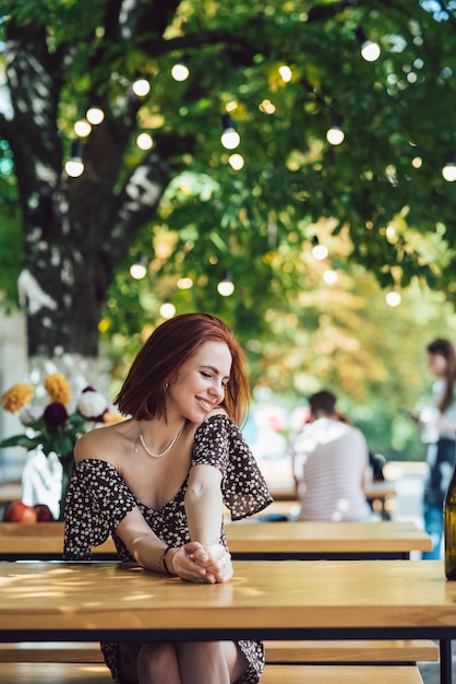 Closeup portrait of two female at summer street cafe