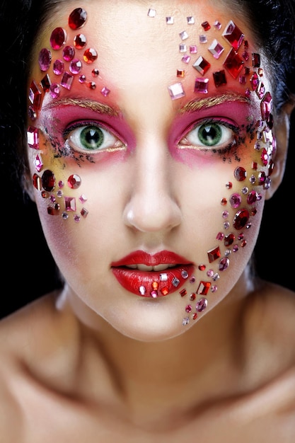 Photo closeup portrait of woman with artistic makeup