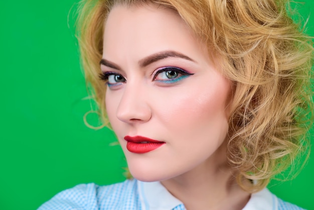 Closeup portrait of woman with bright pin up make up pinup clothes portrait of sensual blond pin up