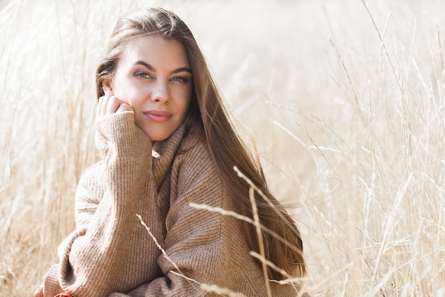 Closeup portrait of young beautiful woman outdoors. Attractive young female 