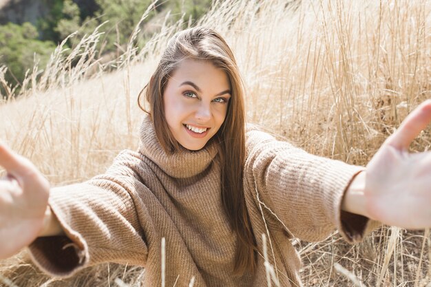 Closeup portrait of young beautiful woman outdoors. Attractive young female 