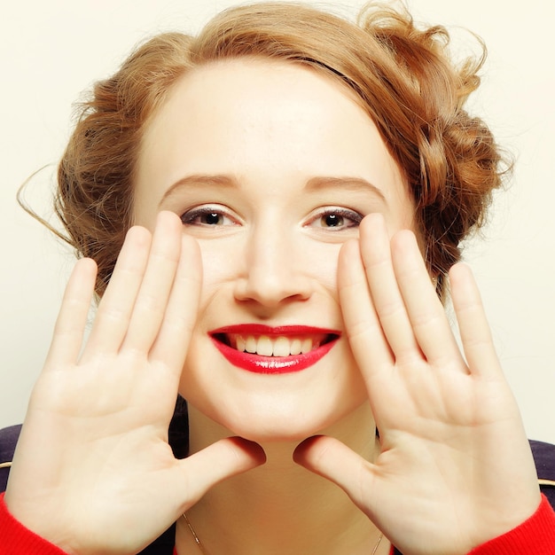 Closeup portrait of young beautiful woman with attractive toothy smile