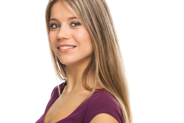 Photo closeup portrait of a young blond woman smiling on white