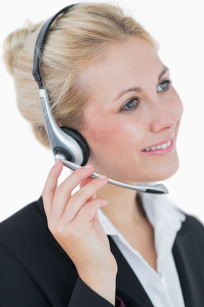 Closeup portrait of young business woman wearing headset