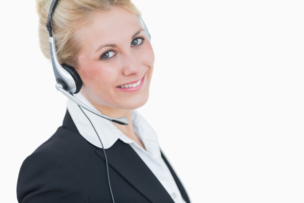 Closeup portrait of young business woman wearing headset